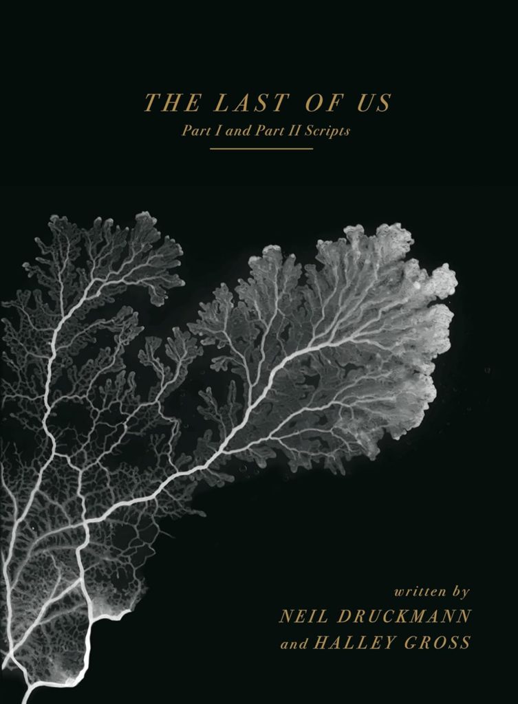 Buckram-tectured cover art. An image of the Cordyceps fungus spreading and growing in grey atop a black background. Gold text reads: "The Last of Us: Part I and II Scripts. Written by Neil Druckmann and Halley Gross." 